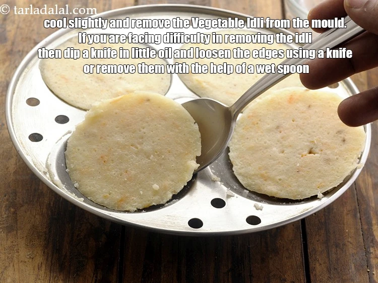 Step 28 – <html><head><meta charset="UTF-8"></head><body><p>Cool slightly and remove the&nbsp;<strong>Vegetable Idli </strong>from the mould. If you are facing difficulty …