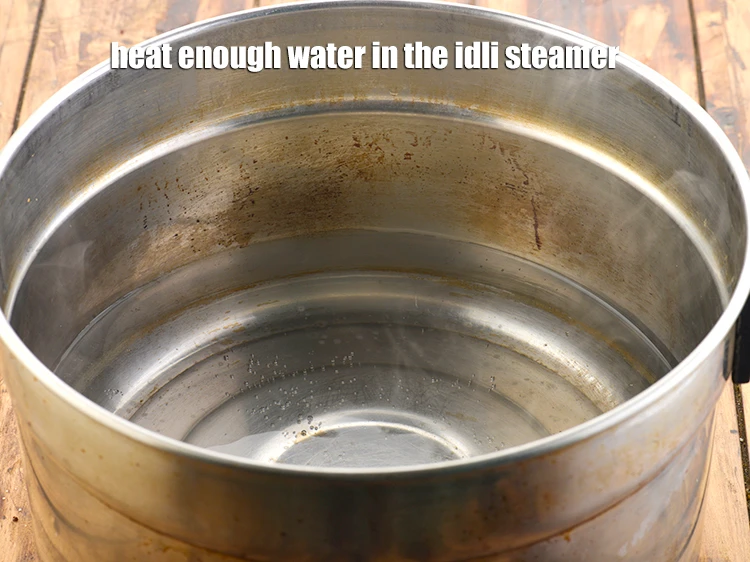 Step 24 – <p>Heat enough water in the idli steamer.</p>
