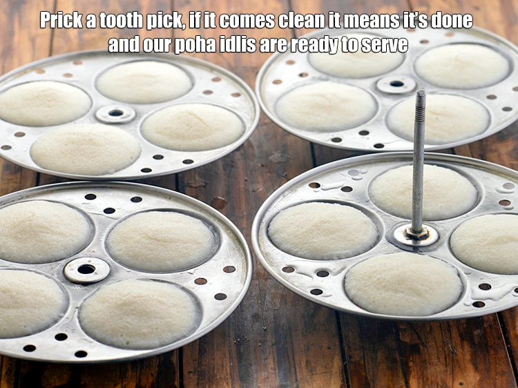 Step 28 – <p>Prick a tooth pick, if it comes clean it means it’s done and our&nbsp;<strong>poha idlis</strong>&nbsp;are …