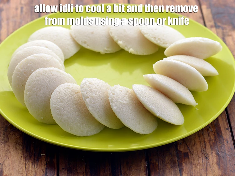 Step 29 – <p>Allow the idli to cool a bit and then remove from molds using a spoon …