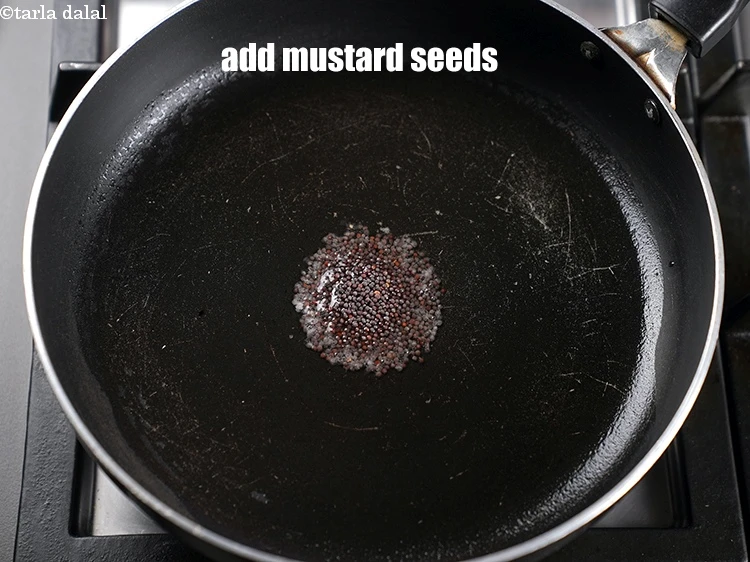 Step 9 – <p>Add 1 tsp <a href="https://www.tarladalal.com/glossary-mustard-seeds-sarson-rai-sarson-ke-beej-525i">mustard seeds ( rai / sarson)</a>.</p>