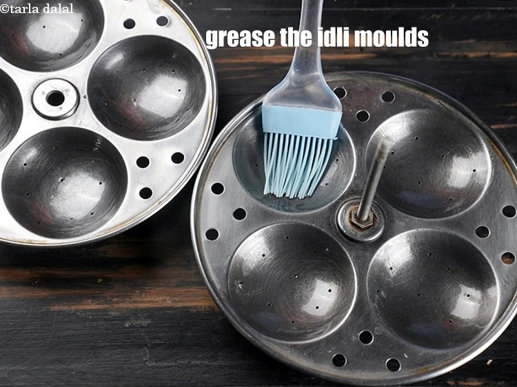 Step 28 – <p>Grease the idli moulds using little oil.</p>