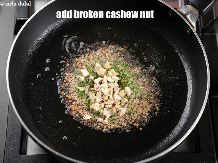Step 13 – <p>Add 1 tbsp <a href="https://www.tarladalal.com/glossary-broken-cashew-nut-906i">broken cashew nut (kaju)</a>.</p>