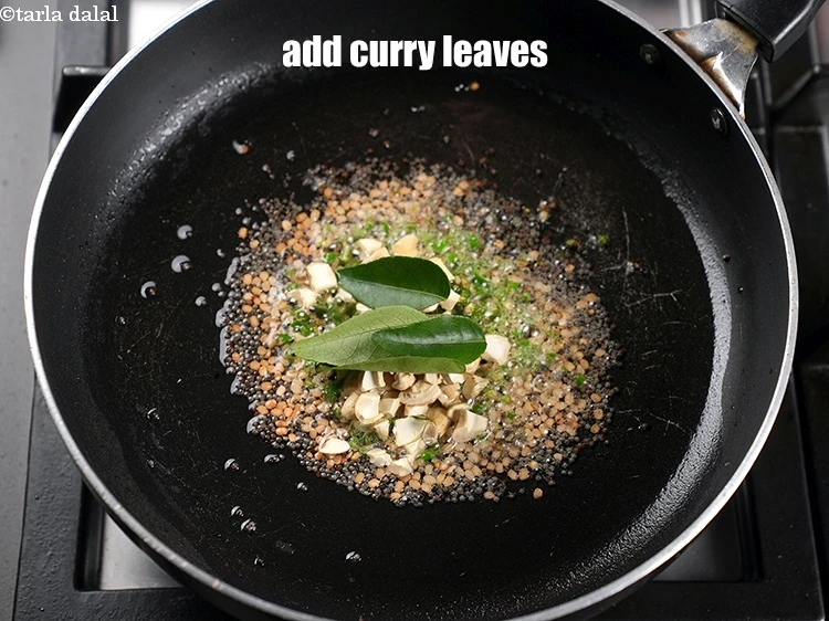 Step 14 – <p>Add 3 to 4 curry leaves.&nbsp;</p>