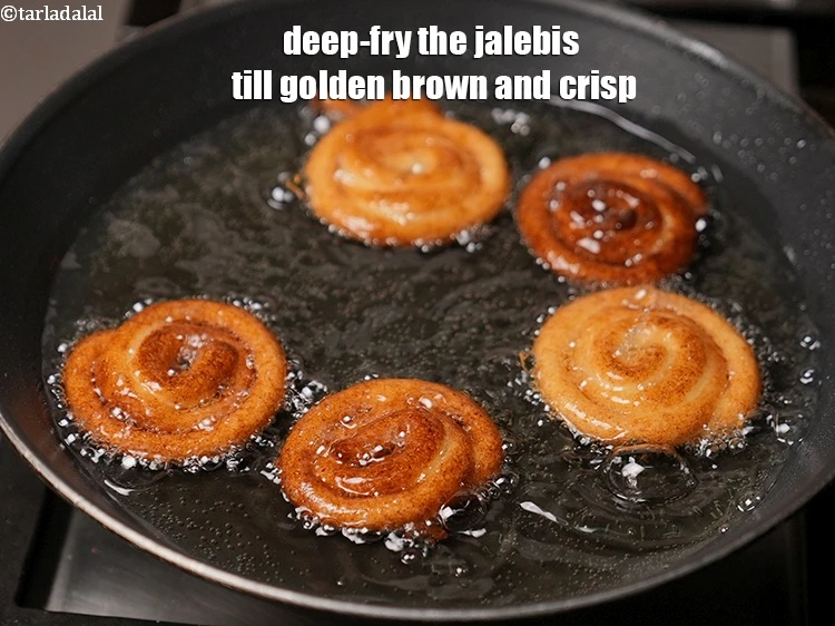 Step 18 – <p>Deep-fry the jalebis till golden brown and crisp.</p>