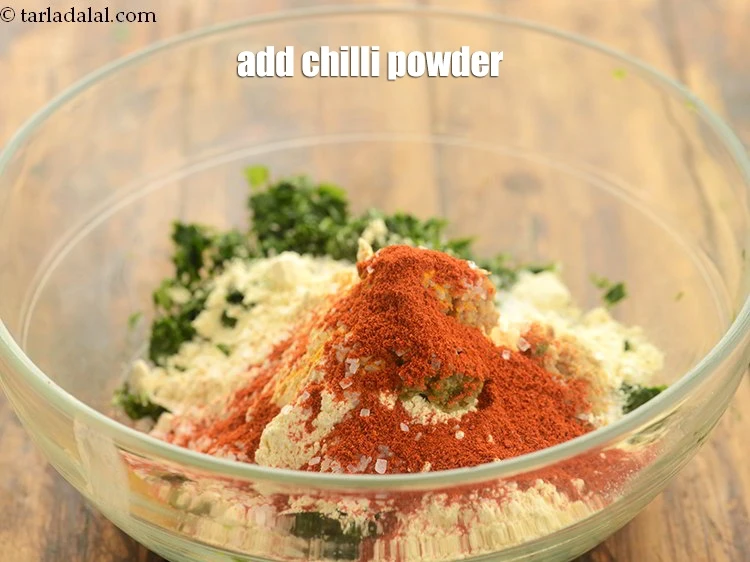 Step 13 – <p>Add 1 tsp <a href="https://www.tarladalal.com/glossary-chilli-powder-red-chilli-powder-339i"><u>chilli powder</u></a>. If you want the methi muthiya spicier then add …