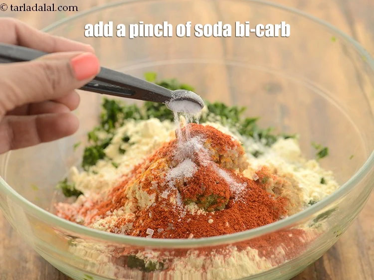 Step 14 – <p>Add a pinch <a href="https://www.tarladalal.com/glossary-baking-soda-soda-bi-carb-615i"><u>baking soda</u></a> bi-carb. This is optional.</p>