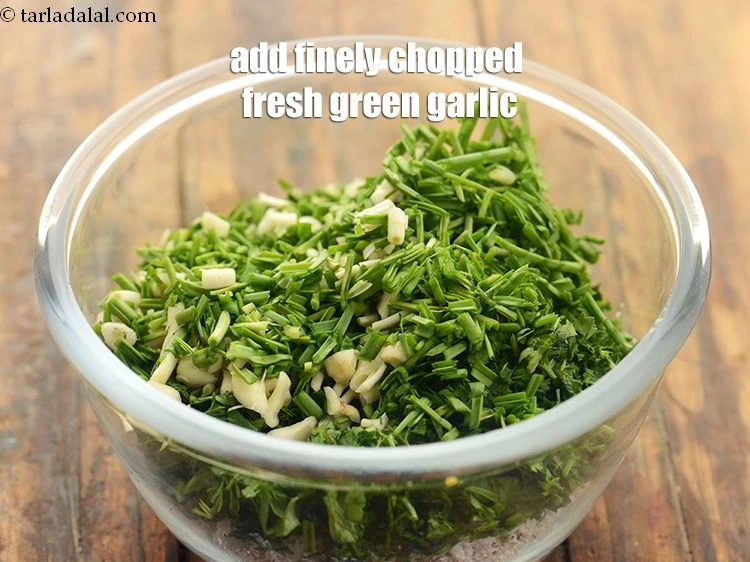 Step 25 – <p>Add 1/3 cup finely <a href="https://www.tarladalal.com/glossary-fresh-green-garlic-hara-lehsun-hara-lahsun-349i#ing_2396"><u>chopped green garlic (hara lehsun)</u></a>. It add incredible depth and …