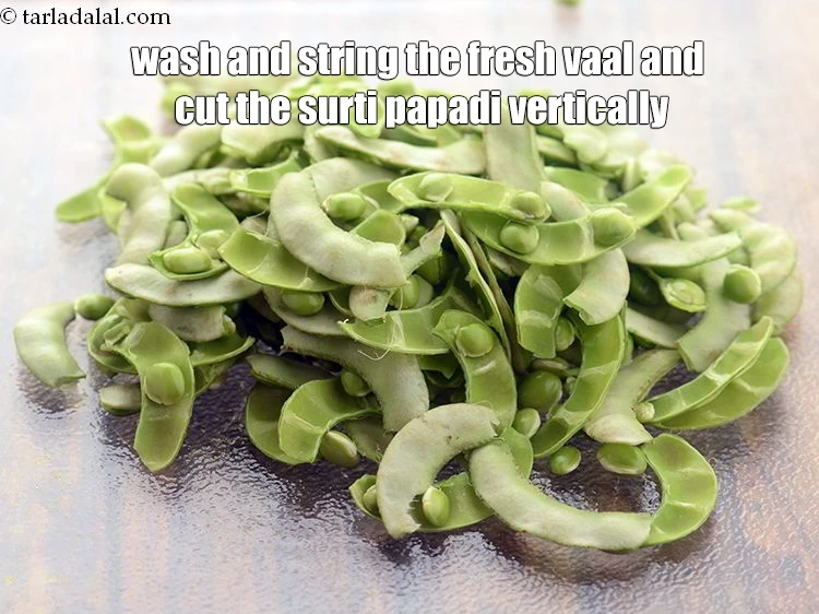 Step 32 – <p><strong>Wash</strong> and string the fresh vaal and cut the surti papadi vertically.</p>