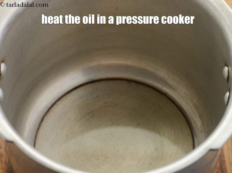 Step 44 – <p>heat the 2 tbsp <a href="https://www.tarladalal.com/glossary-oil-671i"><u>oil</u></a> in a pressure cooker.</p>