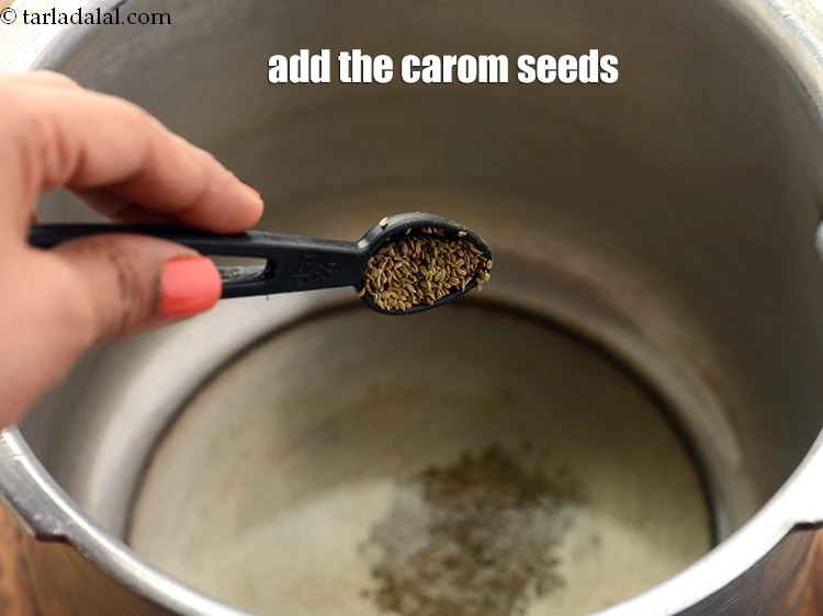 Step 45 – <p>Once the oil is hot, add the 1/2 tsp <a href="https://www.tarladalal.com/glossary-carom-seeds-ajwain-Thymol-seeds-bishops-weed-266i"><u>carom seeds (ajwain)</u></a>. Unlike other …