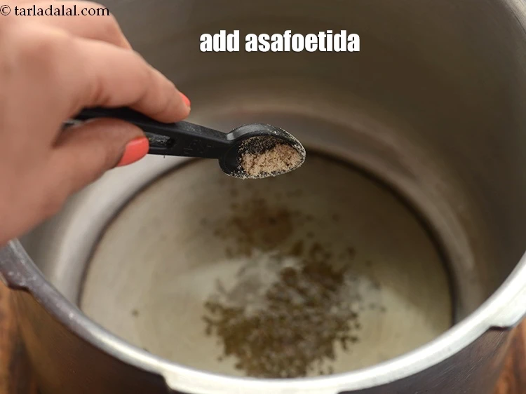 Step 46 – <p>Add 1/4 tsp <a href="https://www.tarladalal.com/glossary-asafoetida-hing-113i"><u>asafoetida (hing)</u></a><u>.</u></p>