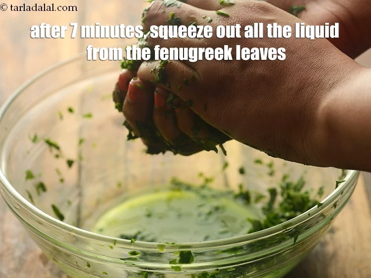 Step 6 – <p>After 7 minutes, squeeze out all the liquid from the fenugreek leaves. The squeezing helps …