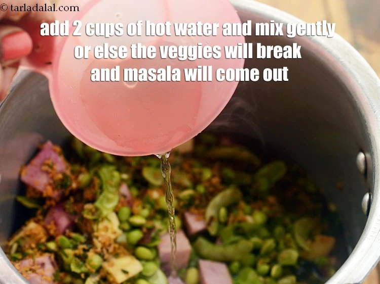 Step 52 – <p>Add 2 cups of <strong>hot water </strong>and mix gently or else the veggies will break …