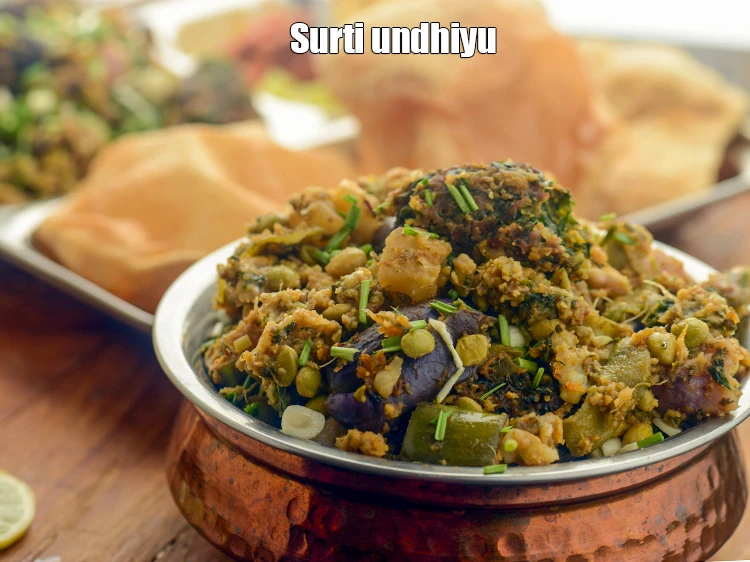Step 59 – <p>Serve <strong>undhiyu</strong> hot garnished with coriander. To make it a feast serve piping hot oondhiyu …