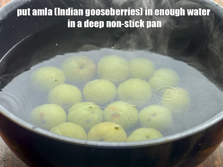 Step 2 – <p>Put <a href="https://www.tarladalal.com/glossary-amla-Indian-gooseberry-49i"><u>amla (Indian gooseberries)</u></a><span style="background-color:rgb(255,255,255);color:rgb(0,0,0);"> in enough water in a deep non-stick pan.</span></p>