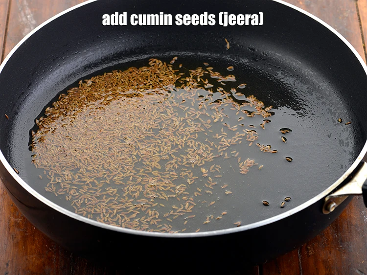 Step 11 – <p><span style="background-color:rgb(255,255,255);color:rgb(0,0,0);">Only when the ghee is hot, add the </span>2 tbsp <a href="https://www.tarladalal.com/glossary-cumin-seeds-jeera-zeera-381i"><u>cumin seeds (jeera)</u></a><span …