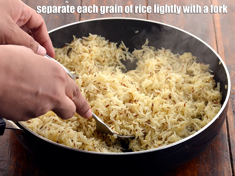 Step 20 – <p><span style="background-color:rgb(255,255,255);color:rgb(0,0,0);">Separate each grain of rice lightly with a fork.</span></p>