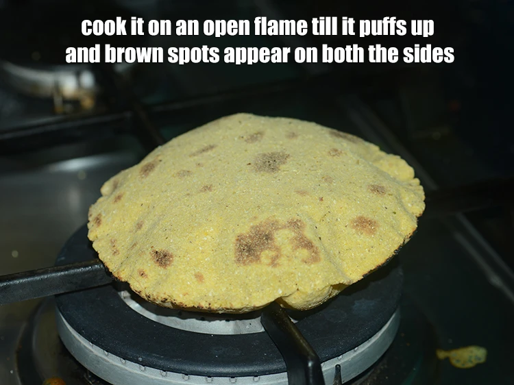 Step 12 – <p>Cook it on an <strong>open flame</strong> till it puffs up and brown spots appear on …