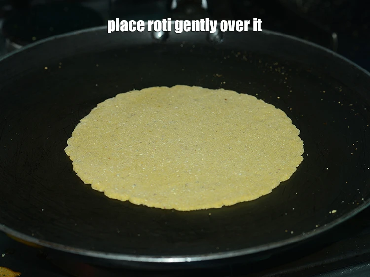 Step 10 – <p>Heat a non-stick tava (griddle) on a high flame and when hot, place the roti …