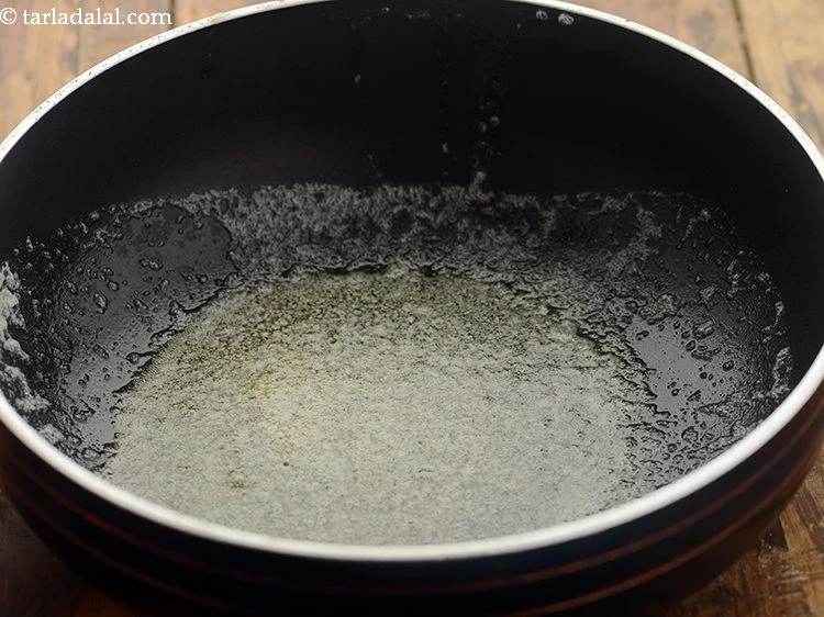 Step 5 – <p>Further, heat 1 tbsp <a href="https://www.tarladalal.com/glossary-butter-makhan-233i"><u>butter</u></a> in a deep non-stick pan.</p>