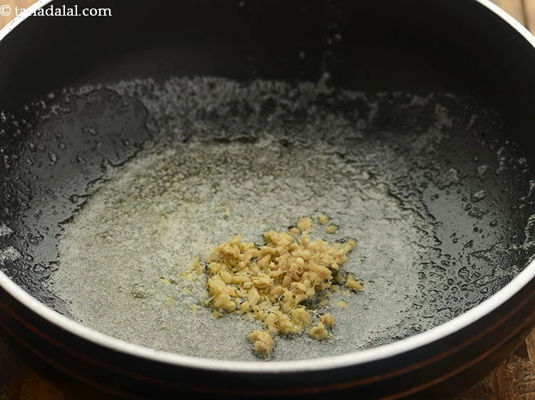 Step 6 – <p>Add 1 1/2 tsp finely <a href="https://www.tarladalal.com/glossary-ginger-adrak-453i#ing_2366"><u>chopped ginger (adrak)</u></a><u>.</u></p>