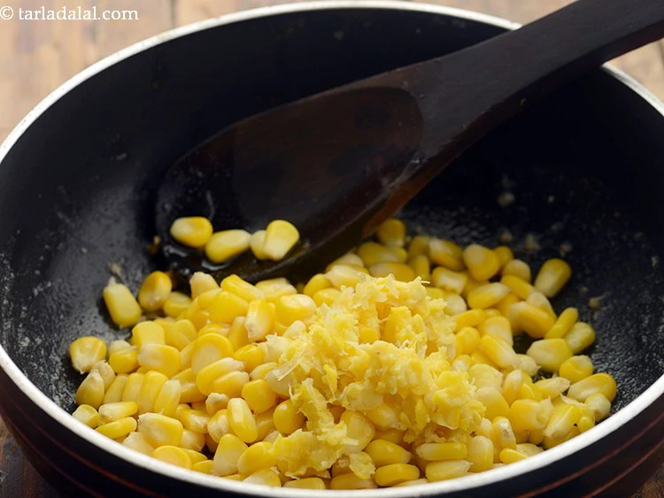 Step 10 – <p>Add 1/4 cup <a href="https://www.tarladalal.com/glossary-sweet-corn-kernels-makai-ke-dane-156i#ing_2549"><u>boiled and crushed sweet corn kernels</u></a> which will again help to …