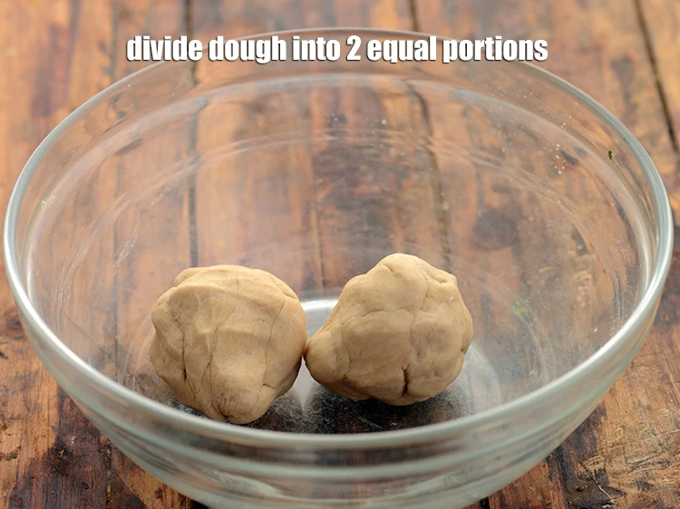 Step 8 – <p>Divide the dough into 2 equal portions.&nbsp;</p>