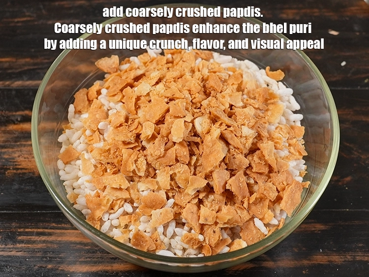Step 2 – <p>Add 1 cup coarsely <a href="https://www.tarladalal.com/glossary-papdi-chaat-chaat-ki-puri-1999i#ing_3447"><u>crushed papdi</u></a>. Coarsely crushed papdis enhance the bhel puri by …