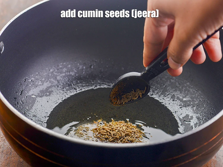 Step 21 – <p>Once the oil is hot, add the 1 tsp <a href="https://www.tarladalal.com/glossary-cumin-seeds-jeera-zeera-381i"><u>cumin seeds (jeera)</u></a><u>.</u></p>