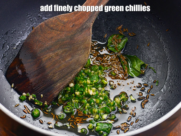 Step 23 – <p>Add the 2 tsp finely <a href="https://www.tarladalal.com/glossary-green-chillies-hari-mirch-331i#ing_2388"><u>chopped green chillies</u></a>. You can also add ginger to …