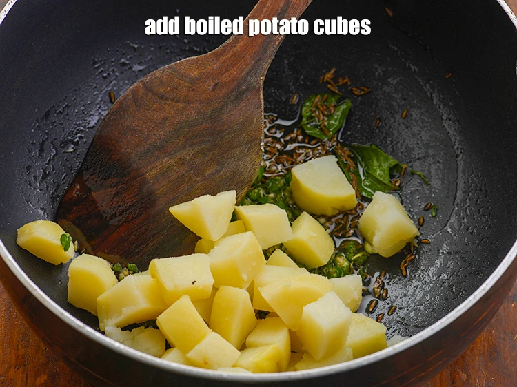 Step 24 – <p>Add the 3/4 cup <a href="https://www.tarladalal.com/glossary-potatoes-aloo-alu-batata-710i#ing_2605"><u>boiled potato cubes</u></a><u>.</u></p>