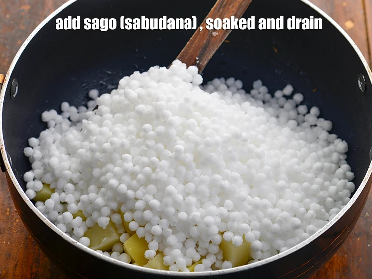 Step 25 – <p>Add the 1 cup <a href="https://www.tarladalal.com/glossary-sago-sabudana-605i"><u>sago (sabudana) </u></a>, washed and drained.</p>