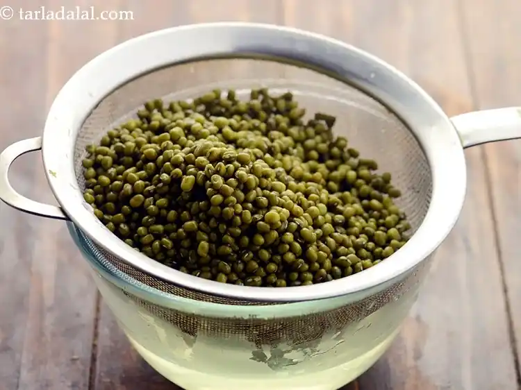 Step 5 – <p>After 3 hours, drain the moong beans.</p>