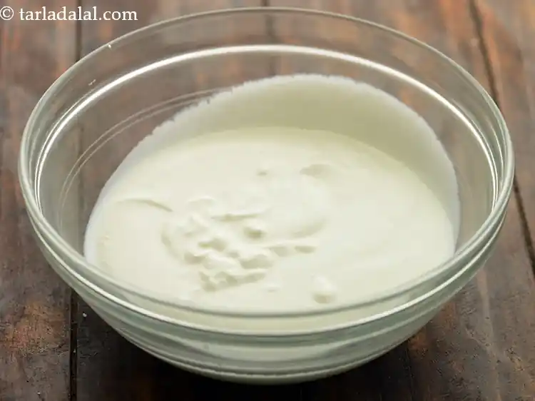 Step 10 – <p>In a deep bowl, take sour curd. The word “khatta” means sour so ensure the …