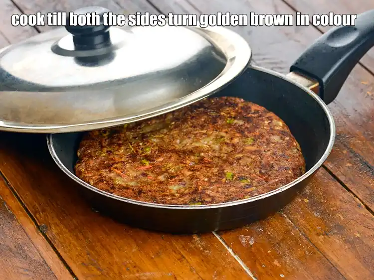 Step 49 – <p>Pour a portion of the batter on it and spread it evenly, cover with a …