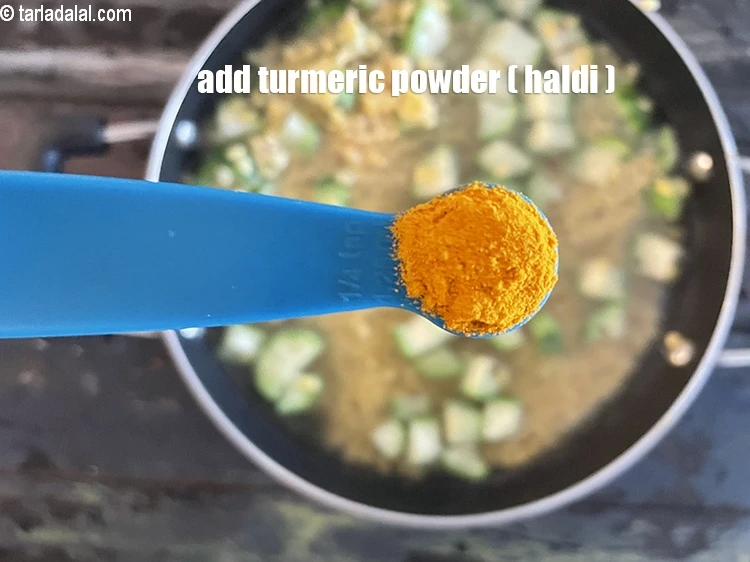 Step 22 – <html><head></head><body><p>Add&nbsp;1/4 tsp&nbsp;<a href="glossary-turmeric-powder-haldi-645i">turmeric powder (haldi)</a>.</p></body></html>