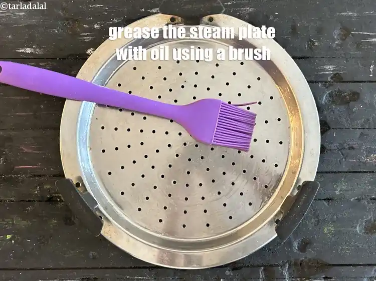 Step 22 – <p>Grease the steamer plate with oil using a brush.</p>