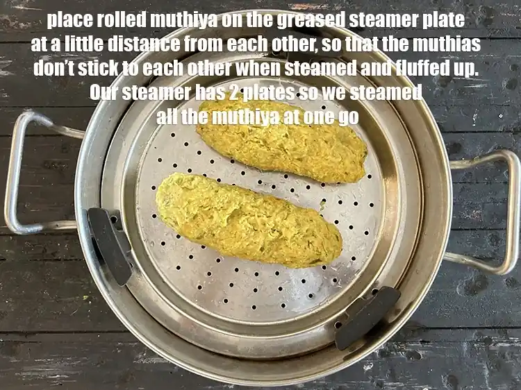 Step 24 – <p>Place rolled muthiya on the greased steamer plate at a little distance from each other, …