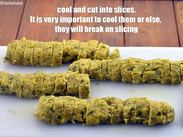 Step 27 – <p>Cool the&nbsp;<strong>doodhi muthiya </strong>and cut into slices.It is very important to cool them or else, …