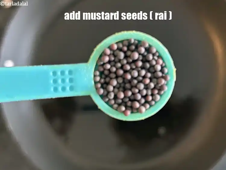 Step 29 – <p>Add the 1/2 tsp&nbsp;<a href="glossary-mustard-seeds-sarson-rai-sarson-ke-beej-525i">mustard seeds ( rai / sarson)</a>.</p>