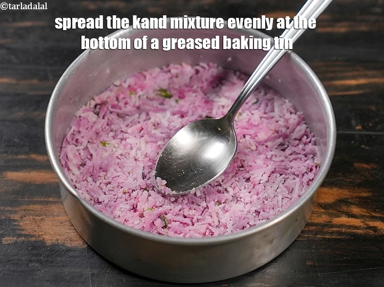 Step 28 – <p>Spread the kand mixture evenly at the bottom of a greased baking tin.</p>