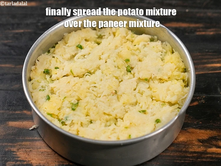 Step 30 – <p>Finally spread the potato mixture over the paneer mixture.</p>