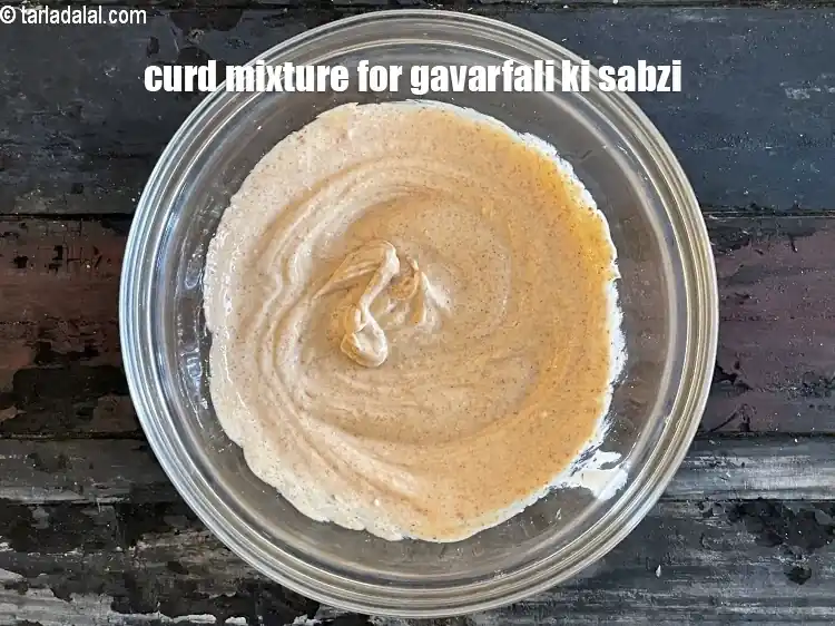 Step 20 – <p>Keep aside. Curd mixture&nbsp;for gavarfali ki sabzi.</p>