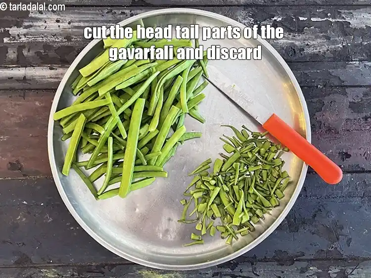 Step 4 – <p>Remove the head and tail part. Club some cluster beans together and chop into 1” …