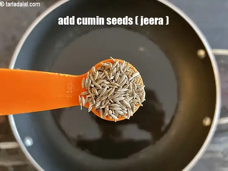 Step 22 – <html><head></head><body><p>Add&nbsp;1 tsp&nbsp;<a href="glossary-cumin-seeds-jeera-zeera-381i">cumin seeds (jeera)</a>.</p></body></html>