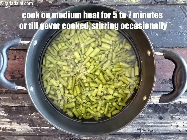 Step 11 – <p>Cook on a medium flame for 5 to 7 minutes or till the cluster beans …