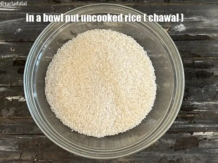 Step 3 – <html><head></head><body><p>In a bowl put&nbsp;2 cups&nbsp;uncooked&nbsp;<a href="glossary-rice-chawal-533i">rice (chawal)</a>.</p></body></html>