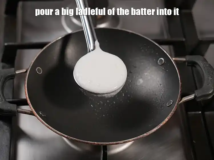Step 33 – <p>Pour a big ladleful of the batter into it.</p>