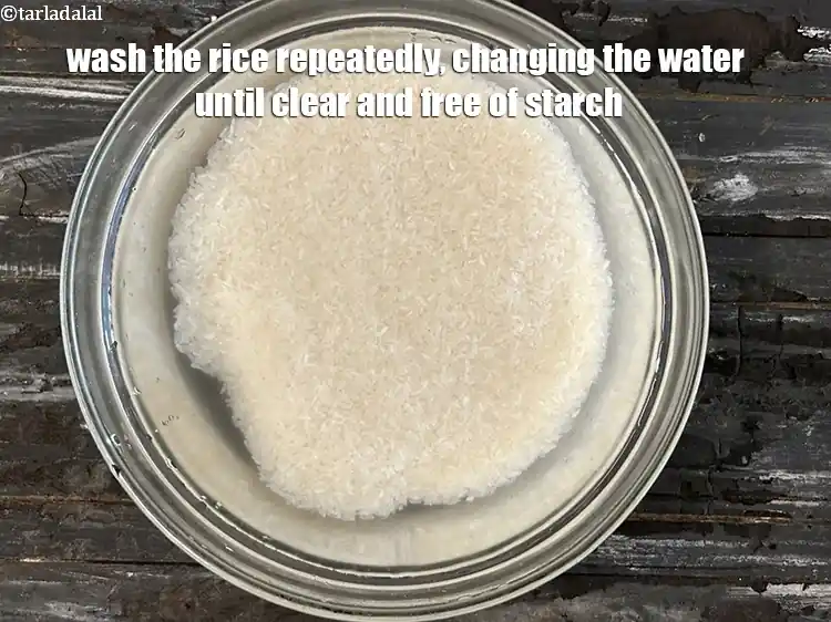 Step 6 – <p>Wash the rice repeatedly, changing the water until it runs clear and free of starch.</p>